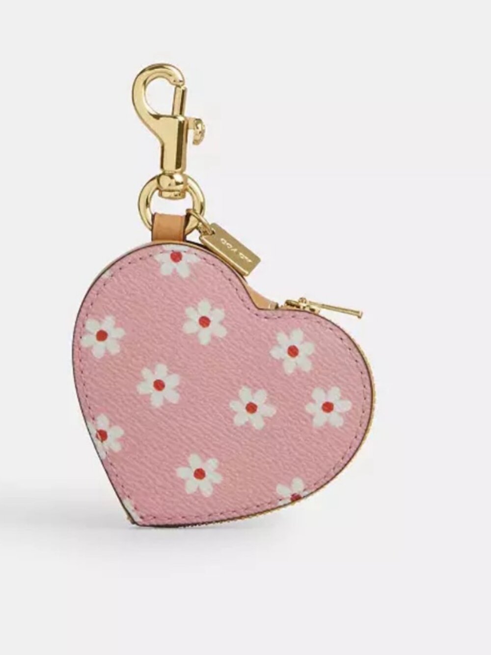 Coach Heart Bag Charm features a white floral print and a gold-toned